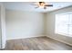 This spacious bedroom offers wood flooring and natural light from a window at 4114 Dunedin Ct, Noblesville, IN 46062