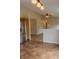 Modern kitchen boasting stainless steel refrigerator, neutral tile floors, and ample storage space at 4114 Dunedin Ct, Noblesville, IN 46062