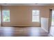 Bright living room with hardwood floors, neutral walls, and windows with outdoor views at 4114 Dunedin Ct, Noblesville, IN 46062
