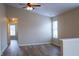Bright living room with ceiling fan, wood floors, and window bringing in natural light at 4114 Dunedin Ct, Noblesville, IN 46062