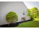 Well-maintained side yard featuring lush landscaping and a vibrant rose bush at 4114 Dunedin Ct, Noblesville, IN 46062