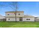 Spacious backyard with a lush green lawn and a two story home at 413 Youngs Creek Ct, Franklin, IN 46131