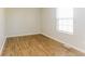 Empty bedroom featuring hardwood floors, neutral paint, and natural light at 413 Youngs Creek Ct, Franklin, IN 46131