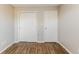 Bedroom with hardwood flooring, fresh paint and a double door closet at 413 Youngs Creek Ct, Franklin, IN 46131