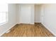 Bedroom with hardwood floors, neutral walls, and natural light from a window at 413 Youngs Creek Ct, Franklin, IN 46131