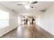 Open-concept living room showcasing hardwood floors and a modern kitchen at 413 Youngs Creek Ct, Franklin, IN 46131