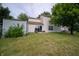 Spacious backyard featuring a well-kept lawn, patio with grill, and a storage shed at 4238 Victory Ct, Indianapolis, IN 46203
