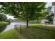 Backyard view featuring a pond, a well-maintained lawn, and a sturdy fence for privacy at 4238 Victory Ct, Indianapolis, IN 46203
