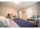 Bedroom with comfortable chair, wooden desk, and a peek into an adjacent room at 4238 Victory Ct, Indianapolis, IN 46203