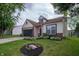 Charming home with an attached garage and a circular landscape accent at 4238 Victory Ct, Indianapolis, IN 46203