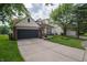 Charming home featuring an attached garage and a well-manicured lawn at 4238 Victory Ct, Indianapolis, IN 46203