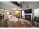 Cozy living room with vaulted ceilings, fireplace, and ample natural light at 4238 Victory Ct, Indianapolis, IN 46203