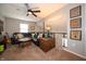 Cozy living room featuring a comfortable sectional sofa, decorative items, and soft lighting at 4238 Victory Ct, Indianapolis, IN 46203