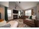 Cozy living room featuring a fireplace, vaulted ceilings, and comfortable seating at 4238 Victory Ct, Indianapolis, IN 46203