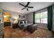 Cozy main bedroom with wood accents, soft lighting, and an ensuite bathroom at 4238 Victory Ct, Indianapolis, IN 46203