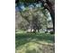Lush backyard featuring mature trees and a verdant lawn at 4633 S County Road 500 E, Plainfield, IN 46168