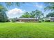 Wide angle view of the backyard lawn at 5205 Staughton Dr, Indianapolis, IN 46226