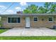 View of the back of the house, showcasing the back door and patio at 5205 Staughton Dr, Indianapolis, IN 46226