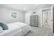 Cozy bedroom featuring a comfortable bed, dresser, and carpeting at 5205 Staughton Dr, Indianapolis, IN 46226