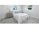 Inviting bedroom with a cozy bed, soft carpet, and ample natural light from dual windows at 5205 Staughton Dr, Indianapolis, IN 46226