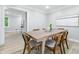 Bright dining area featuring modern table, stylish chairs and contemporary decor at 5205 Staughton Dr, Indianapolis, IN 46226
