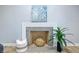 Living room fireplace with neutral paint, contemporary decor, and modern accents at 5205 Staughton Dr, Indianapolis, IN 46226
