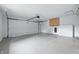 Interior view of the garage with an automatic door and storage cabinet at 5205 Staughton Dr, Indianapolis, IN 46226