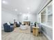 Bright living room featuring neutral paint, wood flooring, a large window, and contemporary furnishings at 5205 Staughton Dr, Indianapolis, IN 46226