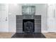Classic fireplace with tile surround in a cozy and comfortable living space at 5205 Staughton Dr, Indianapolis, IN 46226