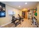 Home gym in basement with exercise equipment and sauna for fitness enthusiasts at 524 W Campbell St, Edinburgh, IN 46124