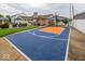 Backyard basketball court alongside an outdoor kitchen and patio seating area at 524 W Campbell St, Edinburgh, IN 46124