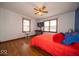 Cozy bedroom with hardwood floors, a ceiling fan, and natural light, perfect for relaxation and comfort at 524 W Campbell St, Edinburgh, IN 46124