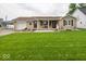 Charming single-story home with a covered front porch and well-maintained lawn at 524 W Campbell St, Edinburgh, IN 46124