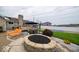 Backyard fire pit with patio furniture, a basketball court and manicured landscaping at 524 W Campbell St, Edinburgh, IN 46124
