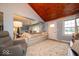 Open-concept living room with modern sofa, wood ceiling, and natural light at 524 W Campbell St, Edinburgh, IN 46124