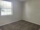 Cozy bedroom with clean, neutral carpet, painted in light grey, and featuring a single window at 5331 Yucatan Dr, Indianapolis, IN 46237
