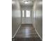 Bright entryway hall with decorative glass front door and wood-look flooring at 5331 Yucatan Dr, Indianapolis, IN 46237