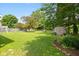 Expansive backyard featuring a shed, landscaping, and a well-maintained lawn, perfect for outdoor activities at 544 Everling Dr, Morgantown, IN 46160