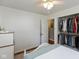 This bedroom has hardwood floors, a ceiling fan, and a door leading to a closet at 544 Everling Dr, Morgantown, IN 46160