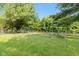 A backyard garden fenced in with raised beds and greenery at 544 Everling Dr, Morgantown, IN 46160