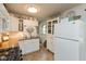 Bright kitchen features stainless sink, appliances, white cabinetry, and wood countertops at 544 Everling Dr, Morgantown, IN 46160
