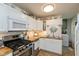 Efficient kitchen featuring white cabinets, butcher block countertops, and stainless steel appliances at 544 Everling Dr, Morgantown, IN 46160