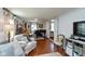 Spacious living room featuring a piano, comfortable seating, and beautiful hardwood floors at 544 Everling Dr, Morgantown, IN 46160