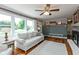 Bright living room with large windows, hardwood floors, comfortable seating, and charming decorative accents at 544 Everling Dr, Morgantown, IN 46160