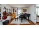 Elegant music room with a grand piano and wall-mounted instruments, perfect for music lovers at 544 Everling Dr, Morgantown, IN 46160