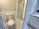 Compact bathroom featuring a toilet, shower, and vanity, maximizing functionality in a small space at 5667 Broyles Rd, Avon, IN 46123
