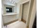 Neutral bathroom featuring a large mirror, vanity, and an open closet with shelving at 5667 Broyles Rd, Avon, IN 46123