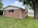 Brick home exterior featuring a well-kept lawn and mature trees in a residential neighborhood at 5667 Broyles Rd, Avon, IN 46123