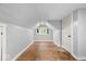 Finished attic space with wood floors, a dormer window, and painted walls at 57 E South St, Mooresville, IN 46158