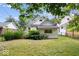 Fenced backyard with mature trees at 57 E South St, Mooresville, IN 46158